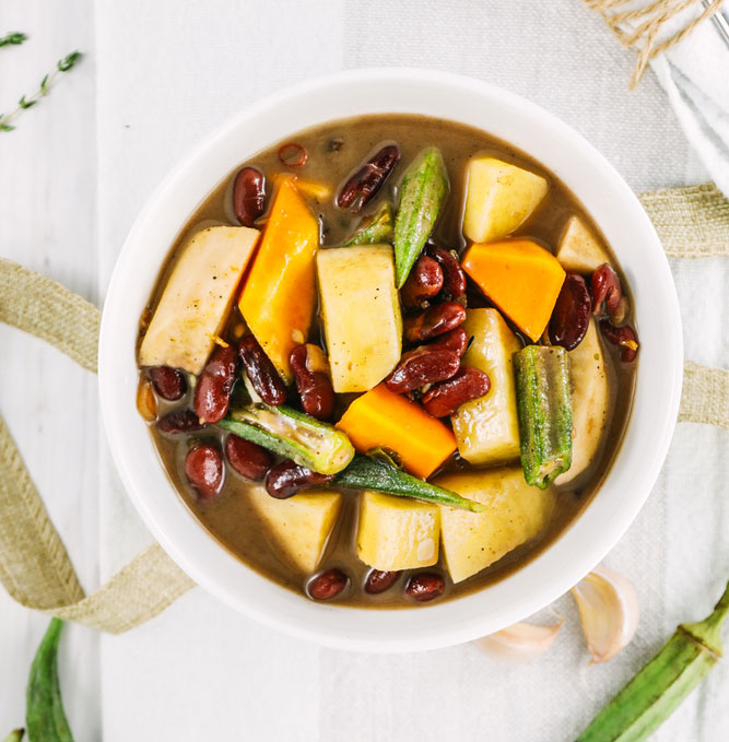 Ital Stew served on the wooden table. Styled shoot